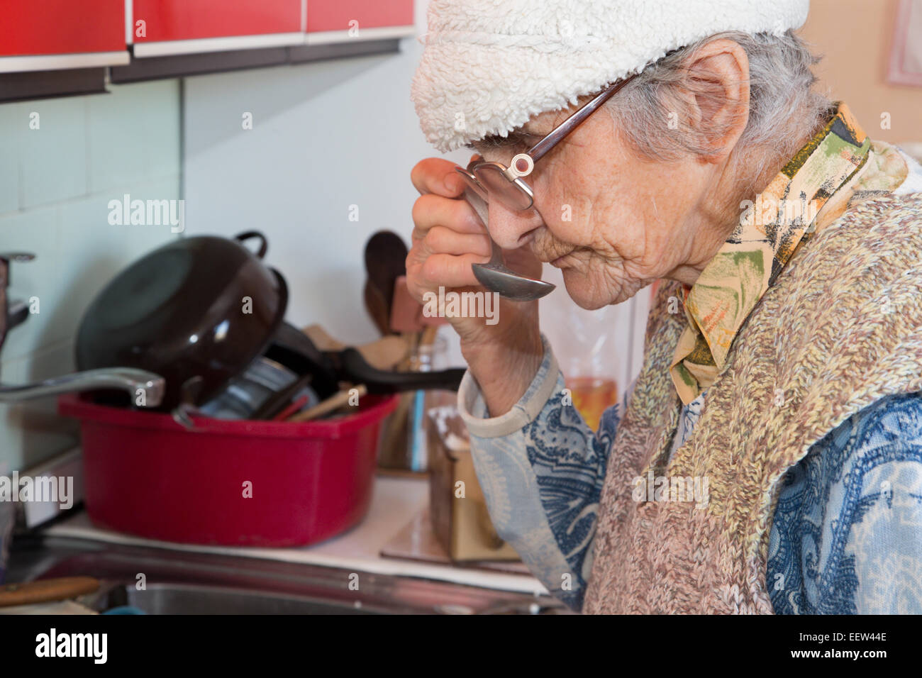 The old woman at tasting on the eat Stock Photo
