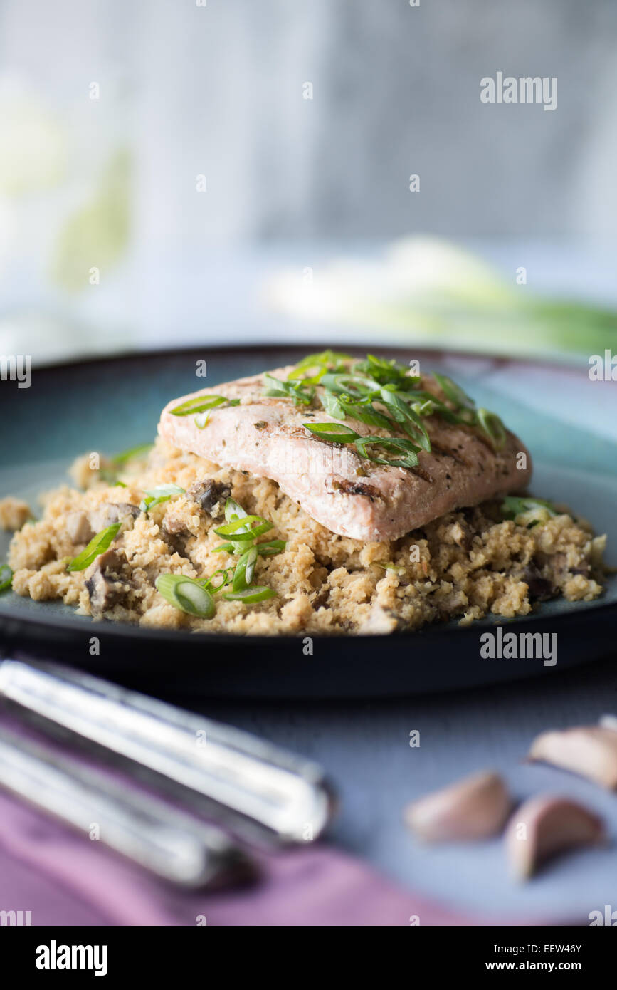 Salmon with Cauliflower rice with miso ginger sauce Stock Photo - Alamy