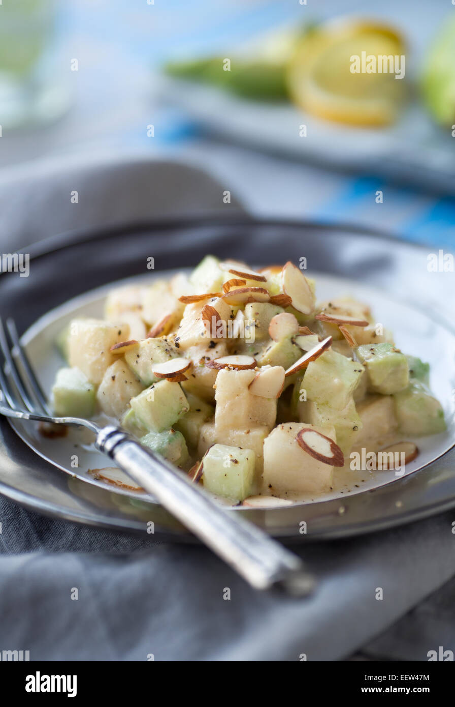 Cucumber avocado pear salad with tahini dressing Stock Photo Alamy