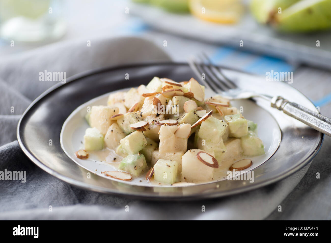 Cucumber avocado pear salad with tahini dressing Stock Photo Alamy
