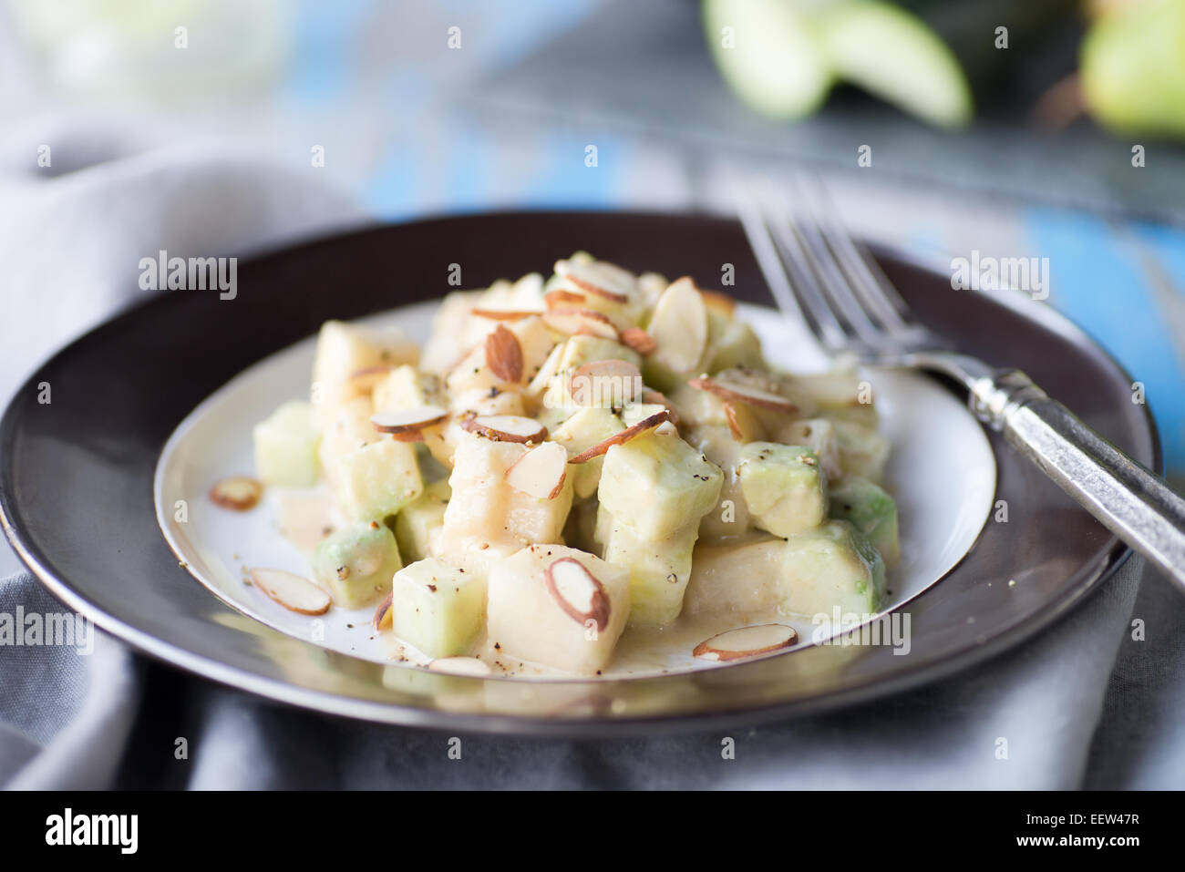 Cucumber avocado pear salad with tahini dressing Stock Photo Alamy