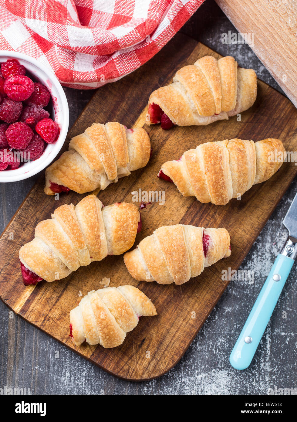 Fresh croissants with raspberries Stock Photo - Alamy