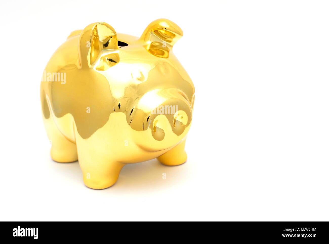 The Golden Pig piggy bank on white background Stock Photo - Alamy