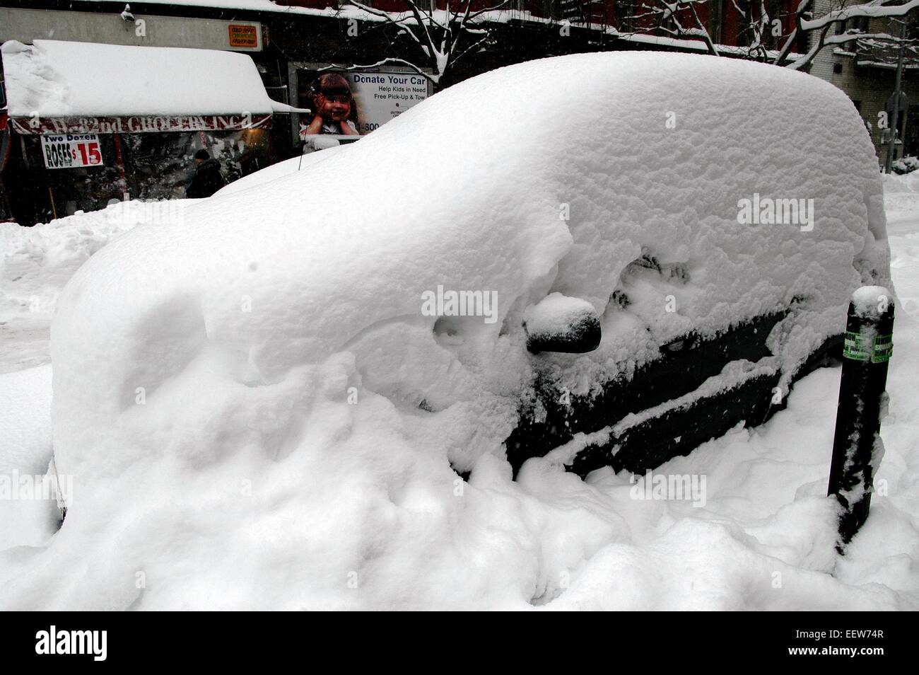 New York City:  A parked car on West 82nd Street is almost buried in snow following a big winter blizzard Stock Photo
