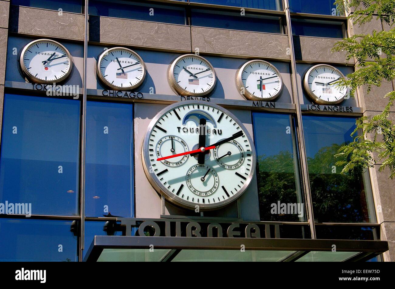 New York City:  Tourneau clocks give the time in various world cities on the exterior of their shop at Time Warner Center Stock Photo