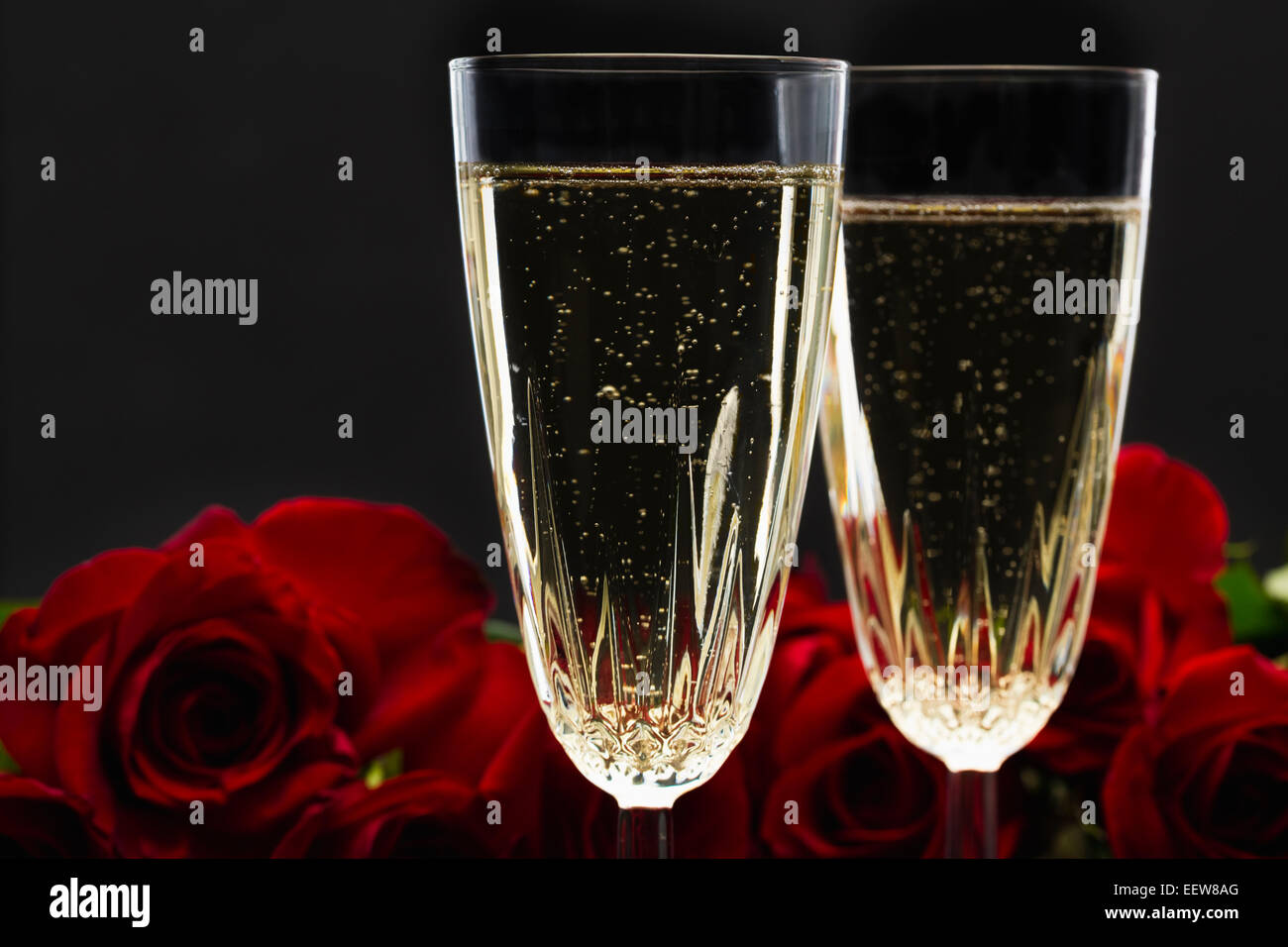 Glasses of champagne and red roses Stock Photo - Alamy