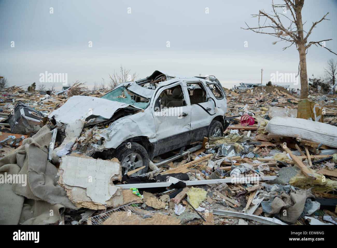 Wreck of car in town destroyed by tornado Stock Photo