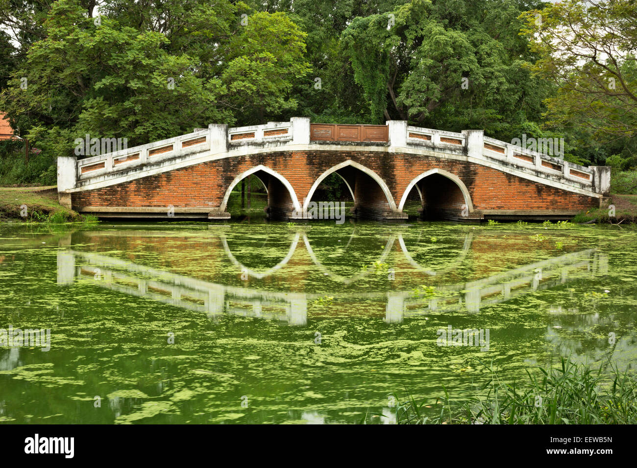 TH00323-00...THAILAND - Bridge over a canal in the Phra Ram Park located at the center of the Ayutthaya Historical Park. Stock Photo