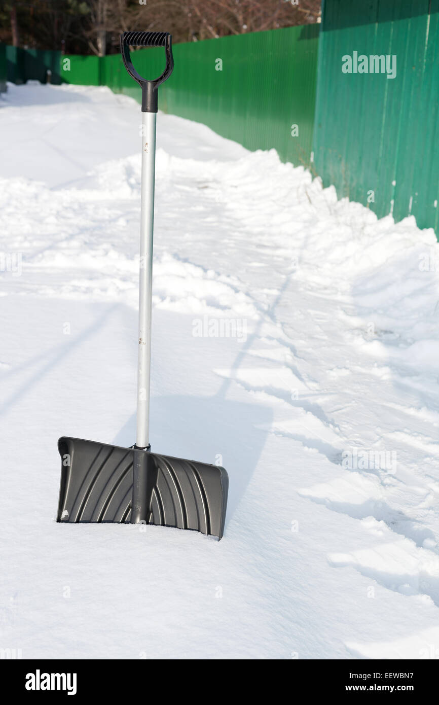 Shovel in snow, ready to removal snow, outdoors Stock Photo Alamy