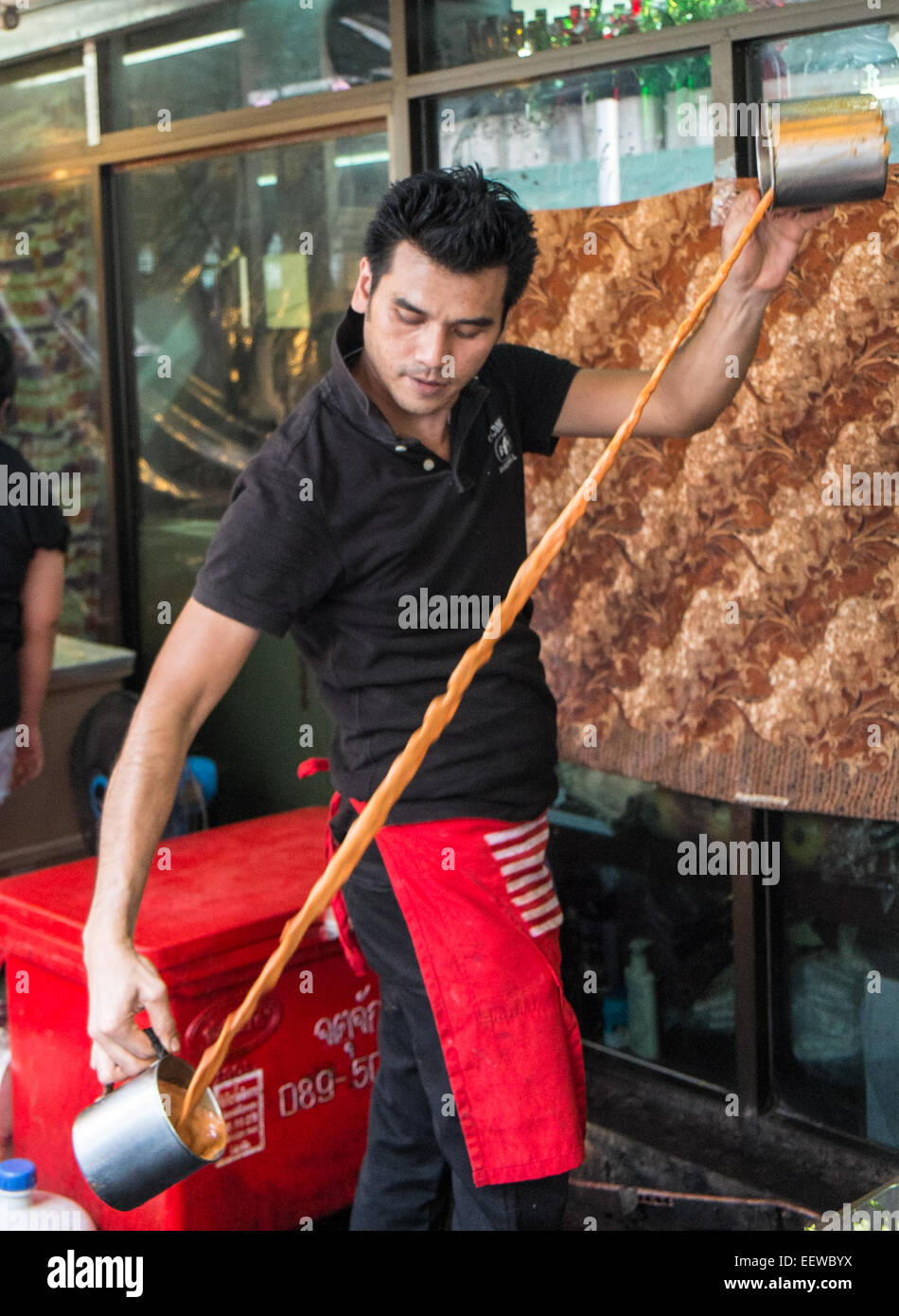 skilled,skill,skilful,pour,pouring,tea,chai,coffee,containers,at,chatuchak,market,weekend,bangkok,thailand, Stock Photo