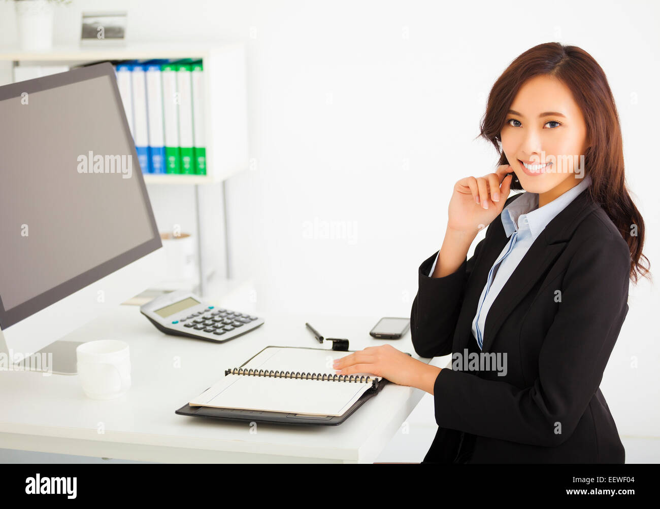 happy young business woman working in the office Stock Photo - Alamy