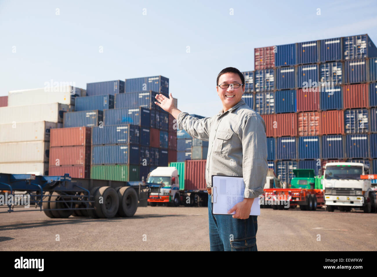 happy man in front of container truck Stock Photo
