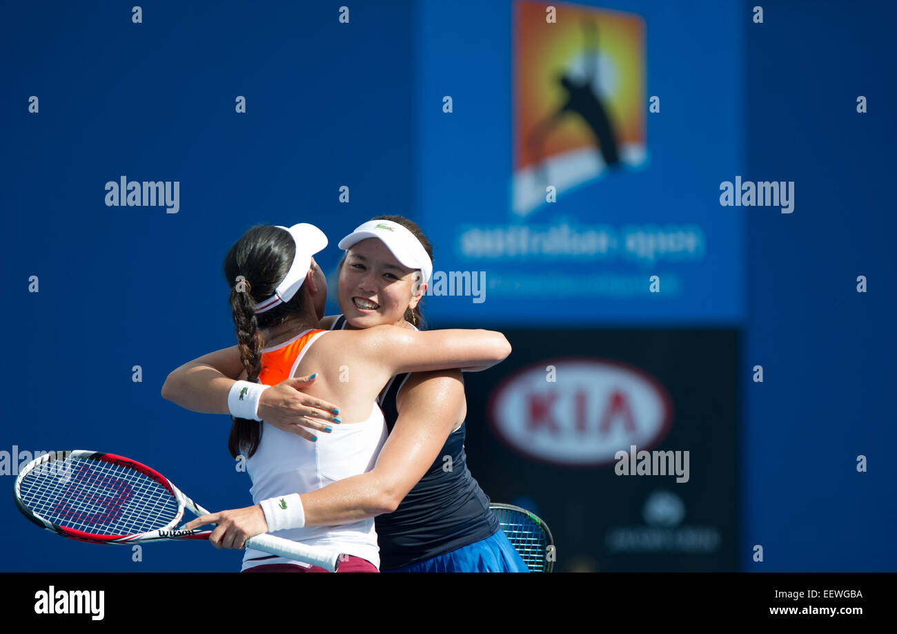 (150122) -- MELBOURNE, Jan. 22, 2015 (Xinhua) -- Zheng Jie (Front) of China and Yung-Jan Chan of Chinese Taipei celebrate after winning their women's doubles first round match against Klara Koukalova of the Czech Republic and Stefanie Voegele of Switzerland at the Australian Open tennis tournament in Melbourne, Australia, Jan. 22, 2015. Zheng Jie and Yung-Jan Chan won 2-0. (Xinhua/Bai Xue) Stock Photo