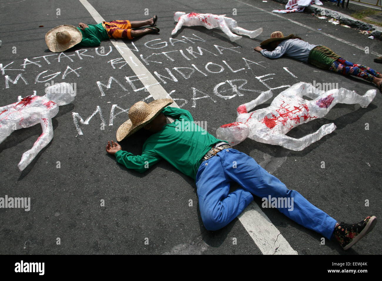 Protesters lie together with plastic statues to commemorate the Mendiola Massacre that happened 28 years ago. (Photo by J Gerard Seguia / Pacific Press) Stock Photo