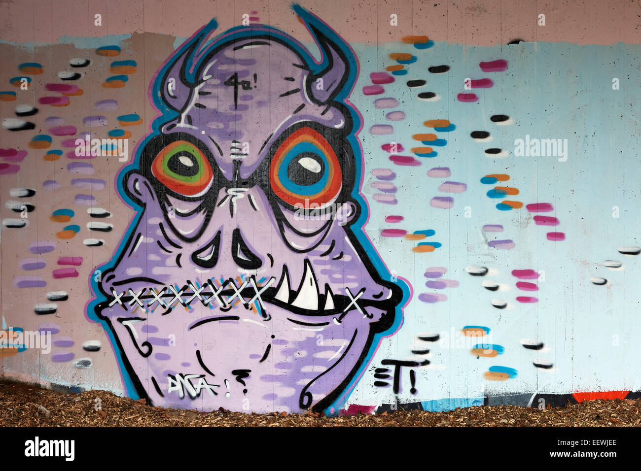 Monster with horns and mouth sewn shut, mural, street art, Düsseldorf, North Rhine-Westphalia, Germany Stock Photo