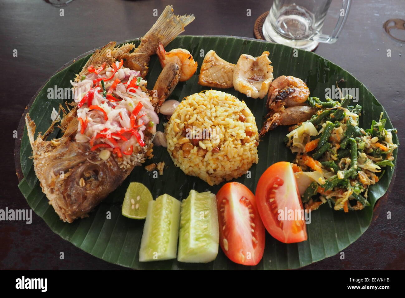 Traditional Balinese food served on a banana leaf. Stock Photo