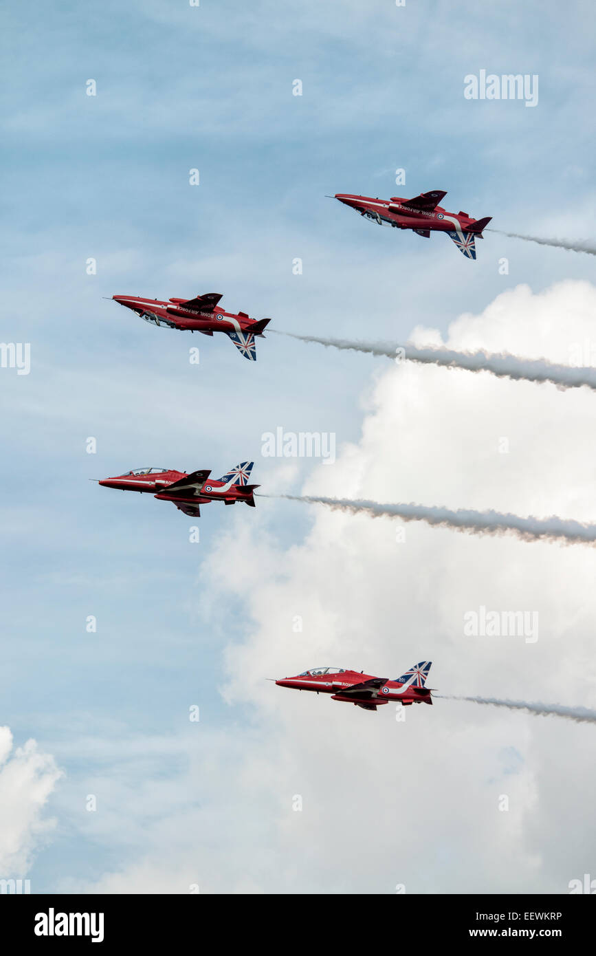 Four Hawk Jet Trainers of the British Royal Air Force Red Arrows Aerobatic Display Team in mirror formation at the RIAT Stock Photo