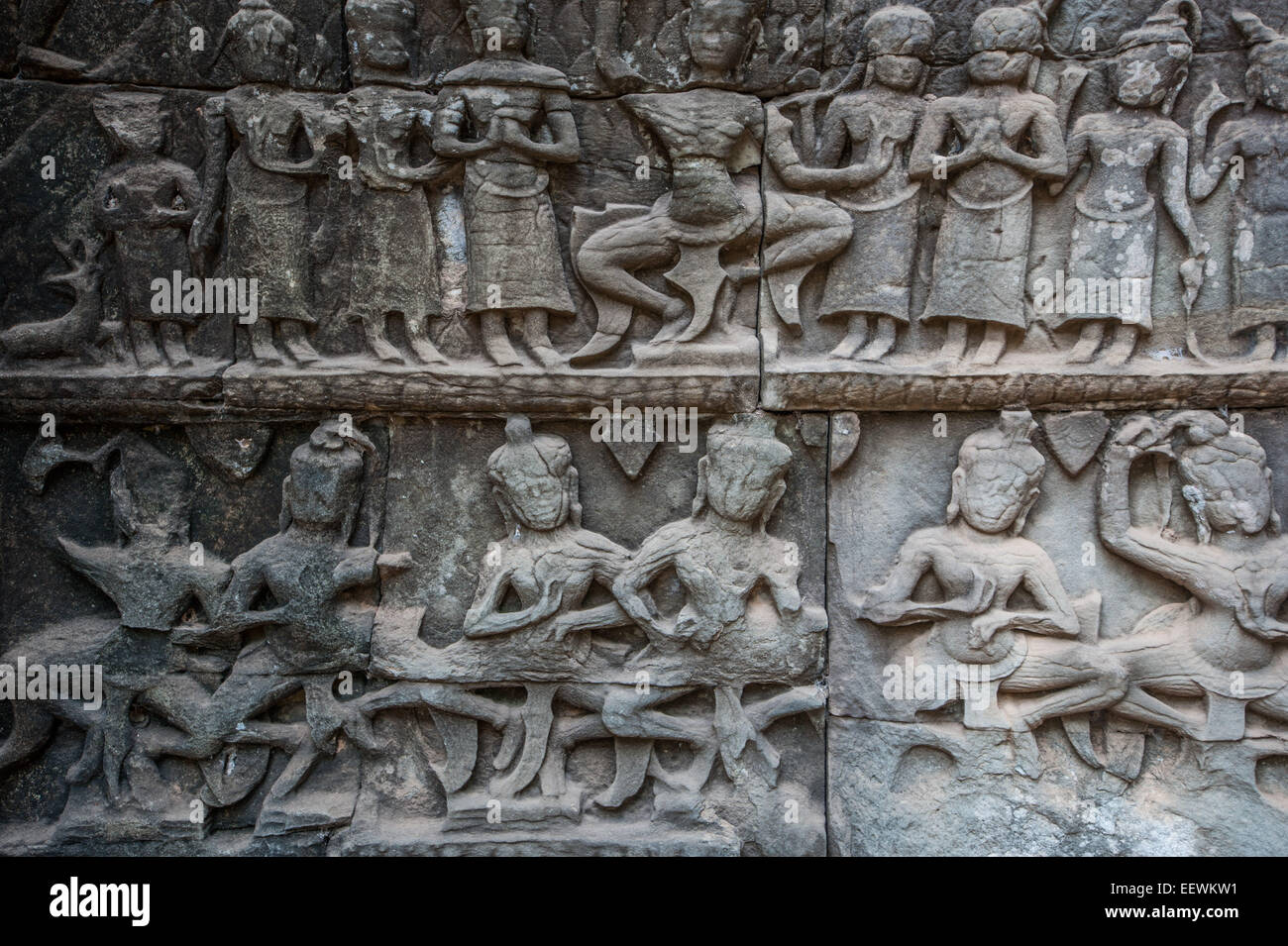 Relief carving on a stone wall at the ruined temple Ta Prohm at Angkor wat, Cambodia Stock Photo