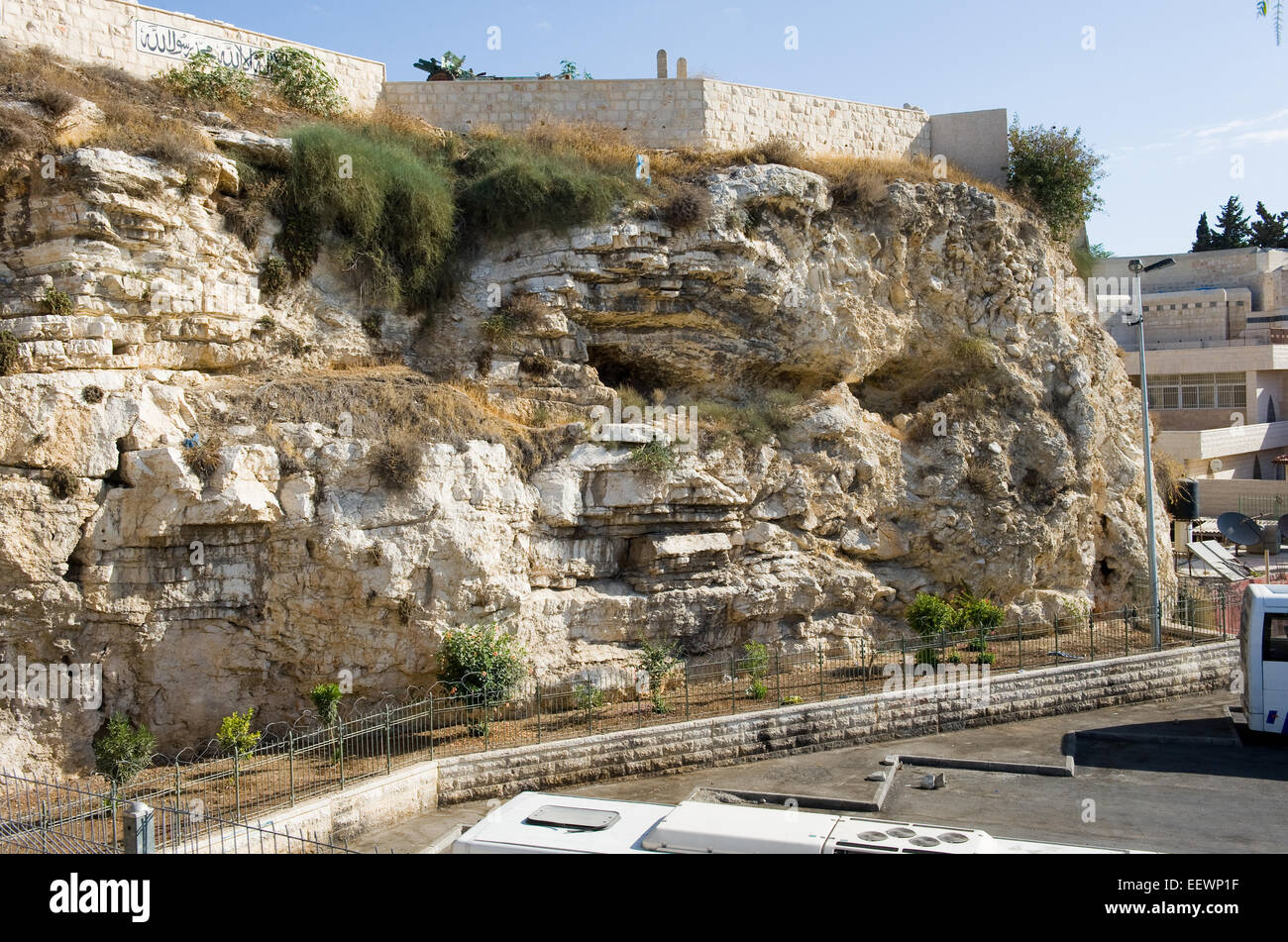 Rock with the shape of a skull near the Garden Tomb in Jerusalem. Pilgrims believe that this could be the rock Golgotha. Stock Photo