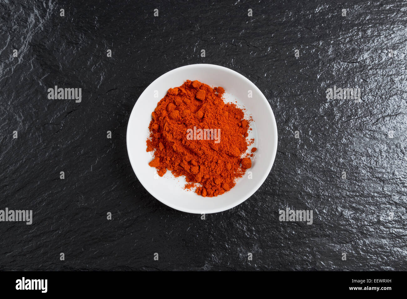 Paprika in a bowl on a slate. Stock Photo