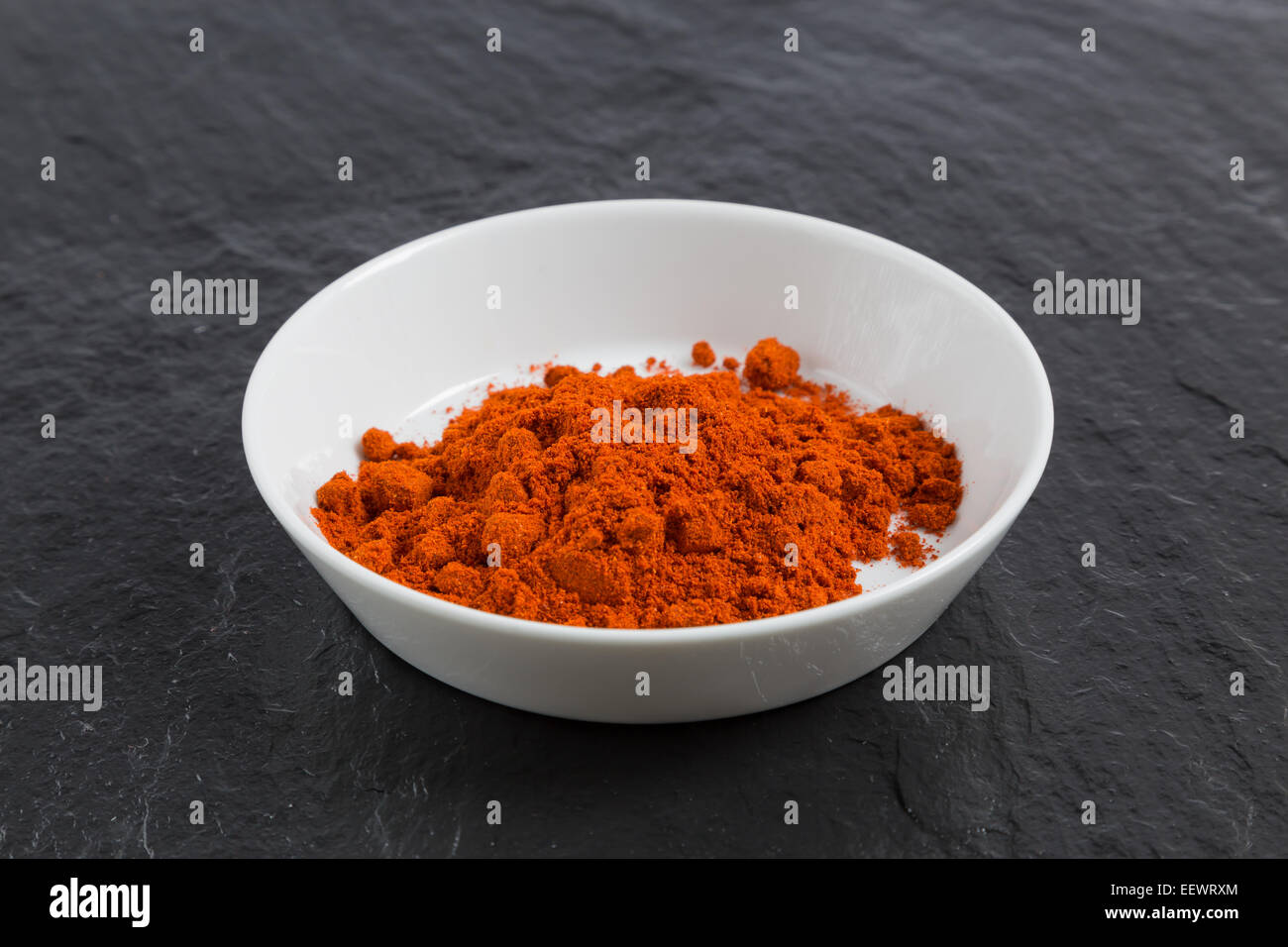 Paprika in a bowl on a slate. Stock Photo