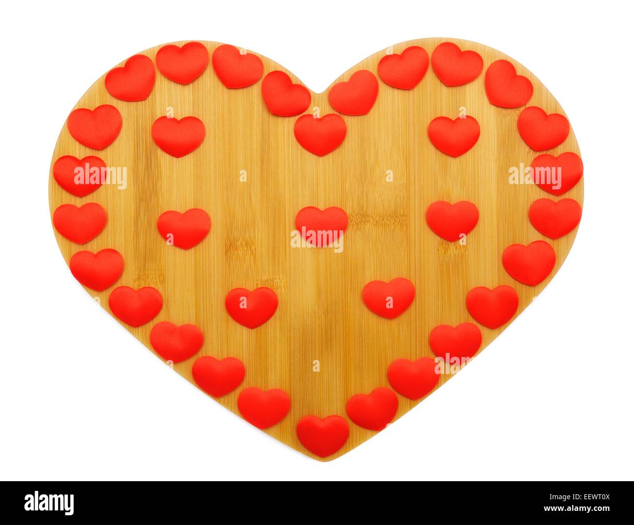 A wooden heart with small red love hearts Stock Photo