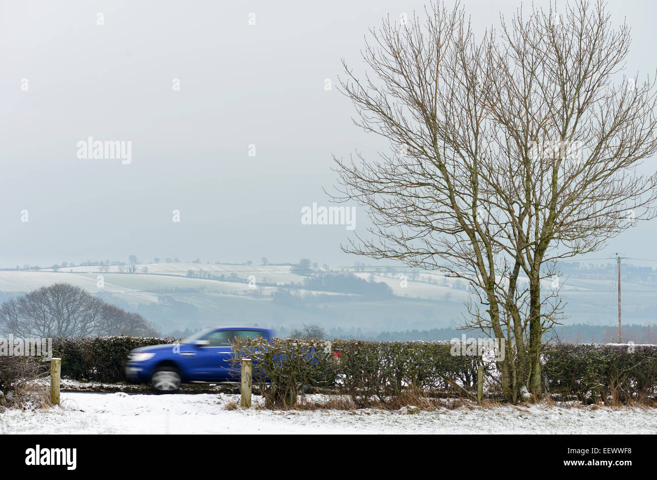 Whashton Green, North Yorkshire, UK. 22nd January, 2015. UK Weather: A van is driven along a quiet road in North Yorkshire where freezing fog and black ice make driving hazardous. © Robert Smith/Alamy Stock Photo