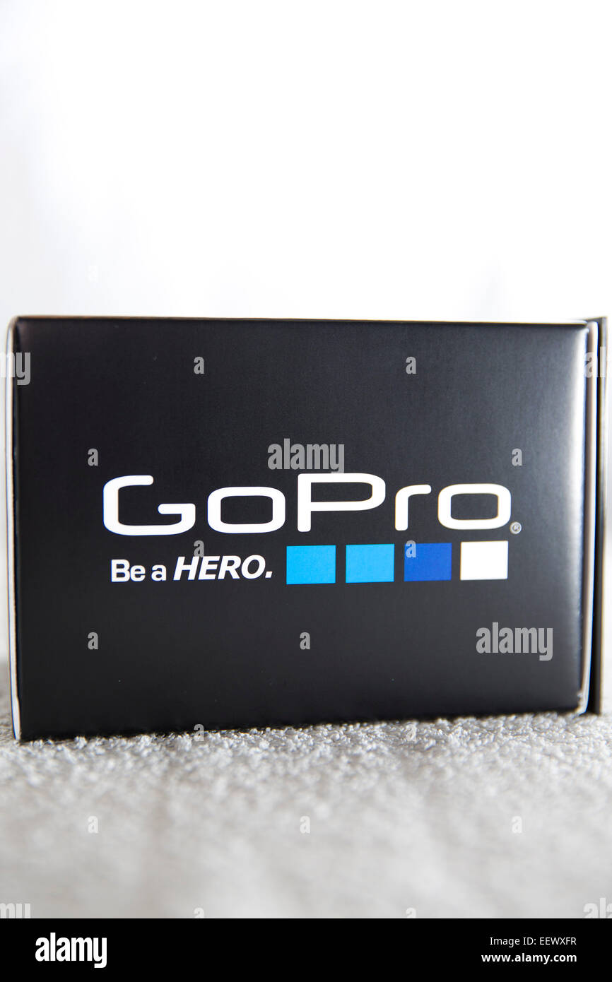 A GoPro Hero 4 Black edition box is pictured in a studio on a white background. Stock Photo