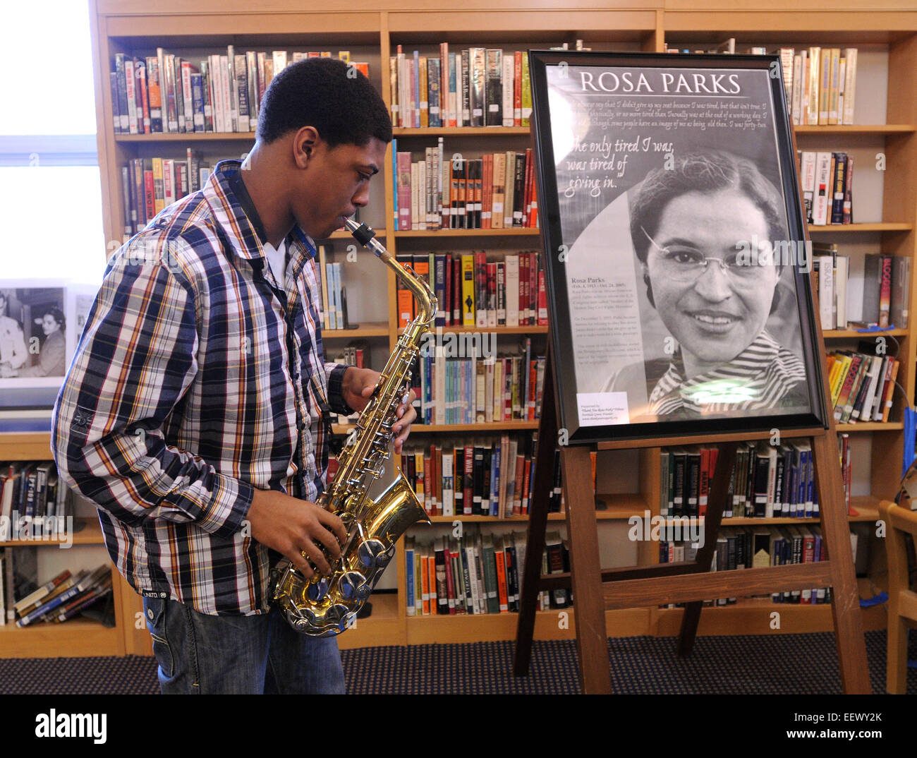 New Haven CT USA-- Corey Staggers, a Junior at Hillhouse High, plays the 'Negro National Anthem' before a lecture on the life of Rosa Parks by Georgette Norman, the director of the Rosa Parks museum in Montgomery Alabama. The event was held in the Hillhouse High School Library. Stock Photo