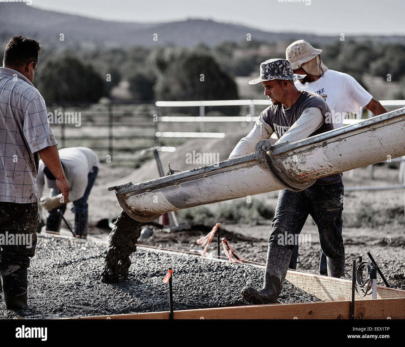 Prescott, Arizona, USA -- July 5, 2012: Concrete workers pouring new cement. Stock Photo