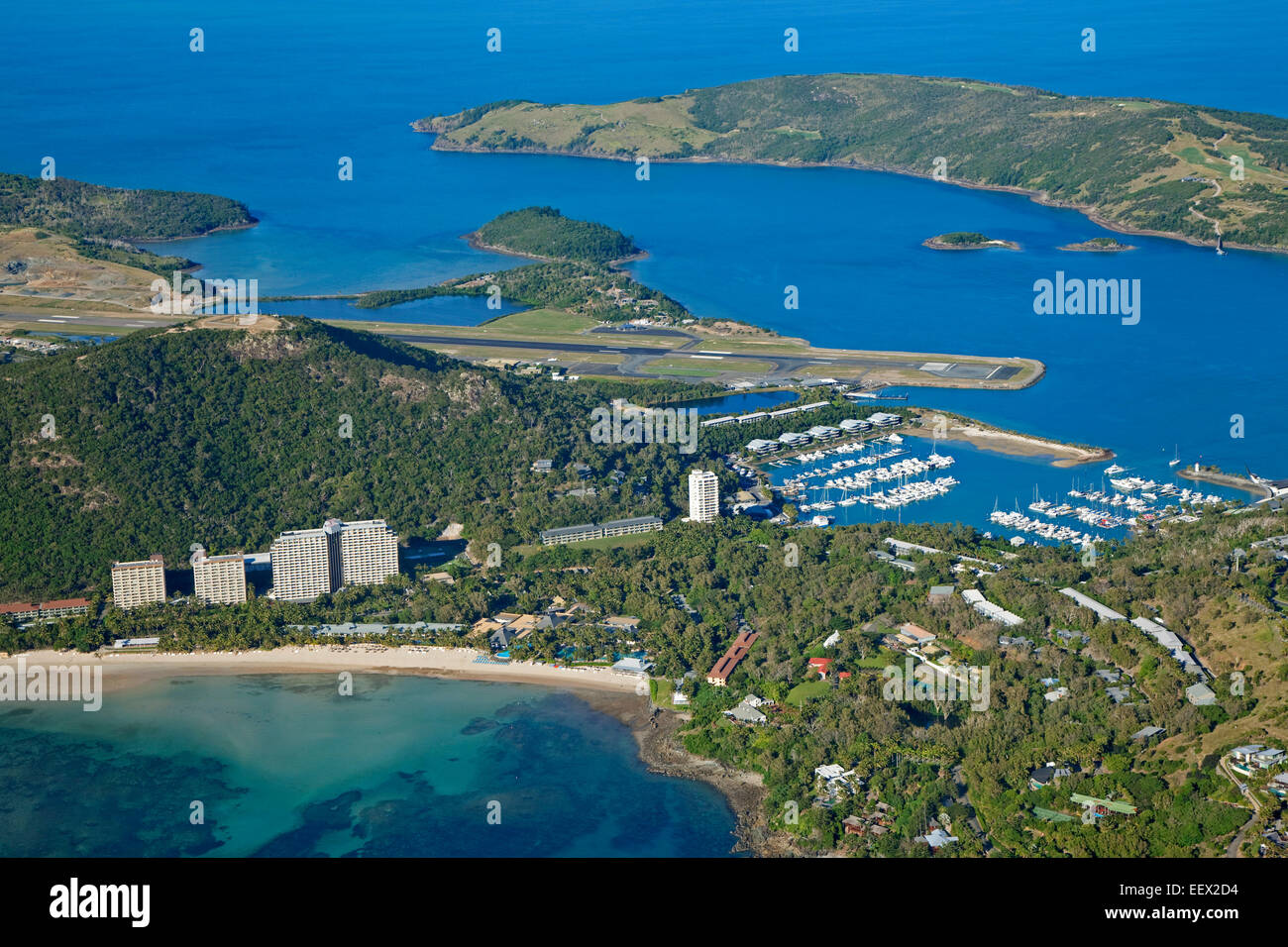 Areal view over marina, beaches and Great Barrier Reef Airport / Hamilton Island Airport in the Coral Sea, Queensland, Australia Stock Photo
