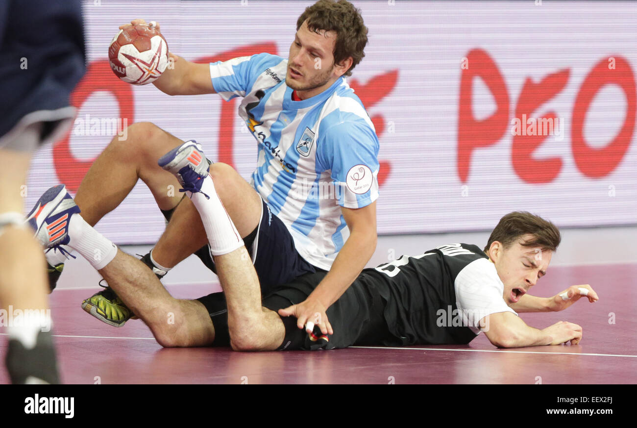 Argentina's Federico Fernandez (L) and Germany's Patrick Groetzki challenge for the ball during the the men's Handball World Championship 2015 Group D match between Germany and Argentina at the Lusail Multipurpose Hall in Lusail outside Doha, Qatar, 22 January 2015. Photo: Axel Heimken/dpa Stock Photo