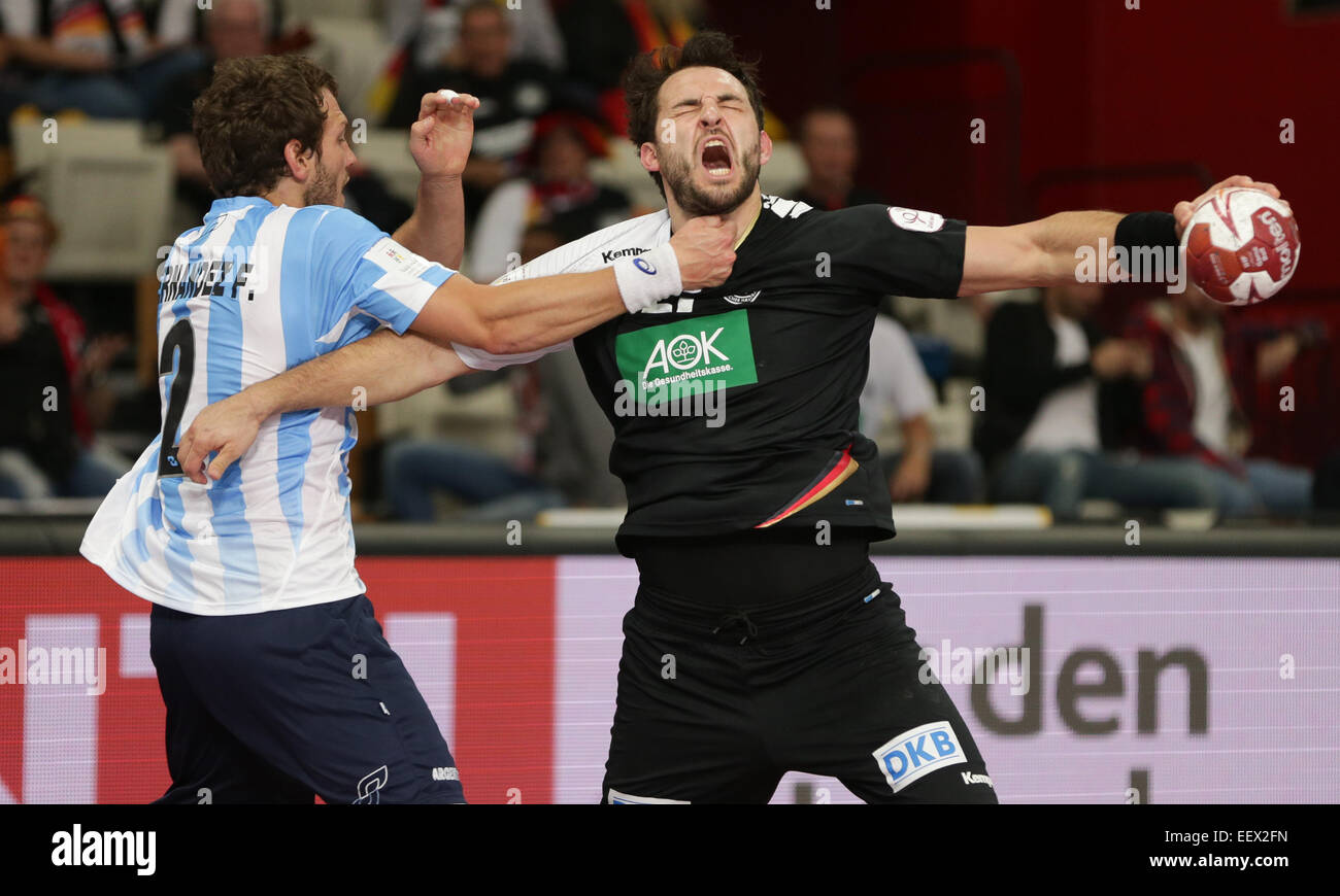 Germany's Michael Mueller (R) is attacked by Argentina's Federico Fernandez during the the men's Handball World Championship 2015 Group D match between Germany and Argentina at the Lusail Multipurpose Hall in Lusail outside Doha, Qatar, 22 January 2015. Photo: Axel Heimken/dpa Stock Photo