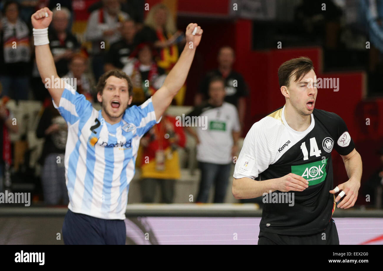 Argentina's Federico Fernandez (L) reacts after a score behind Germany's Patrick Groetzki during the the men's Handball World Championship 2015 Group D match between Germany and Argentina at the Lusail Multipurpose Hall in Lusail outside Doha, Qatar, 22 January 2015. Photo: Axel Heimken/dpa Stock Photo