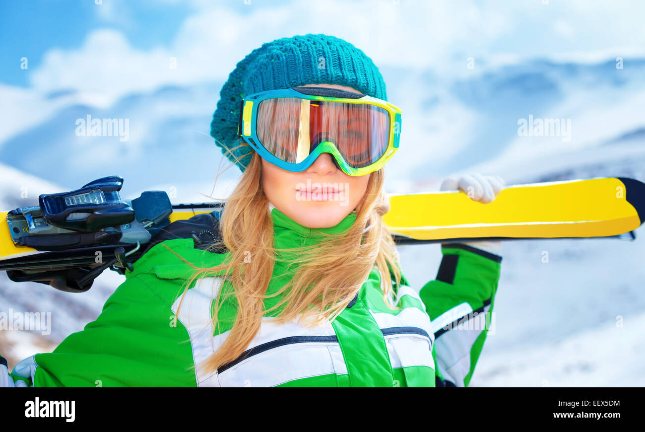 Closeup woman wearing ski goggles hi-res stock photography and