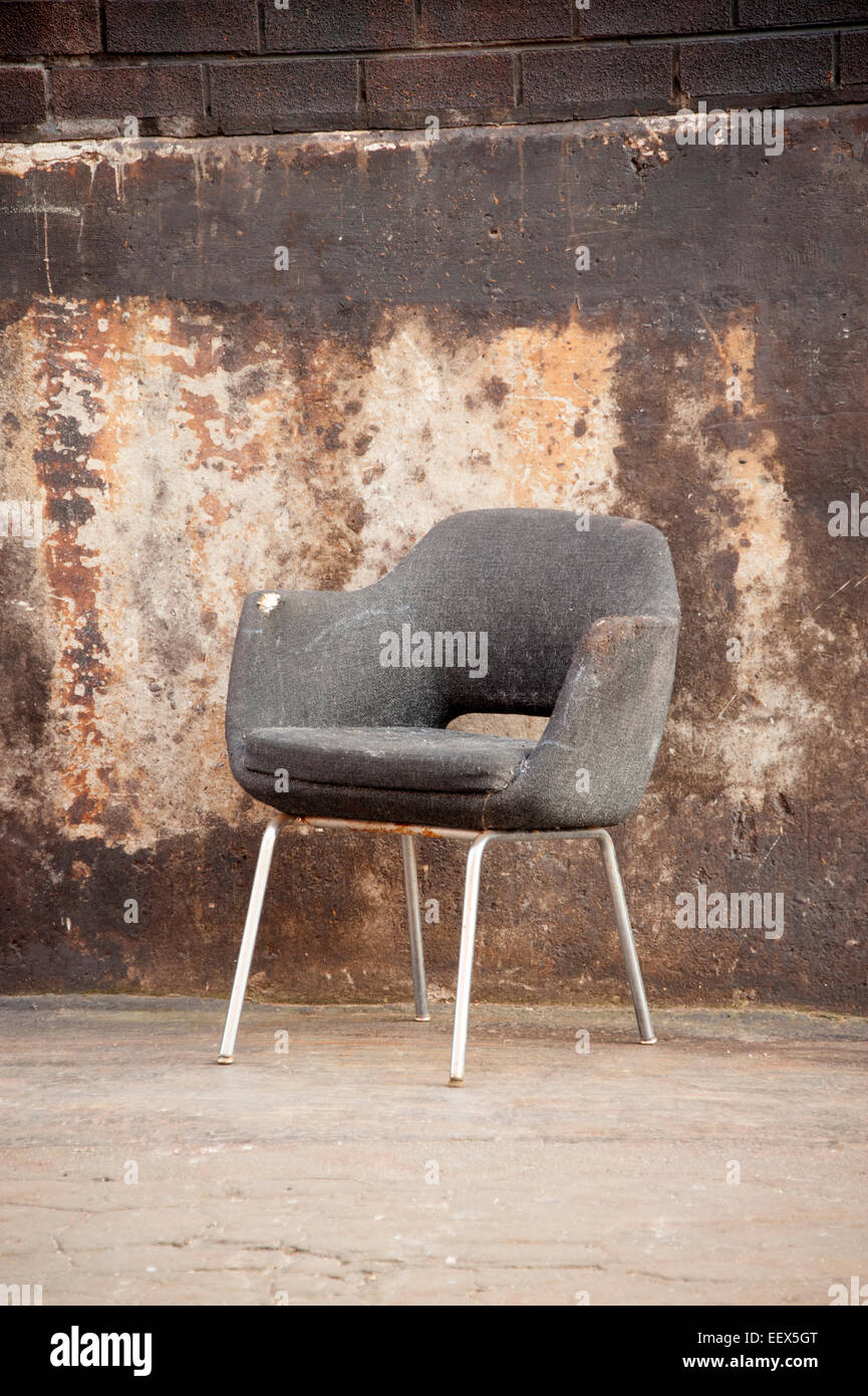 empty brown draylon chair abandoned old vintage Stock Photo