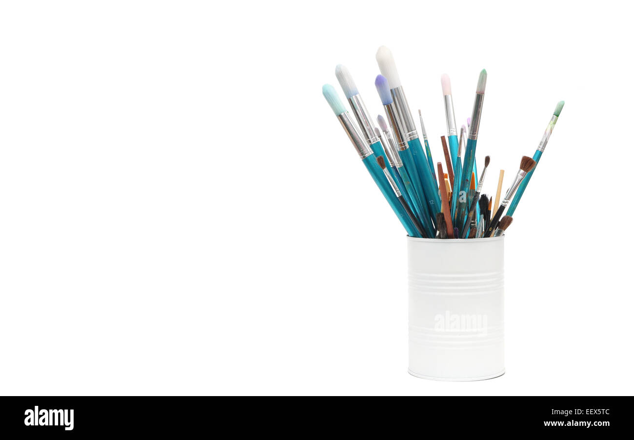blue paint brushes in cup isolated on white background Stock Photo - Alamy