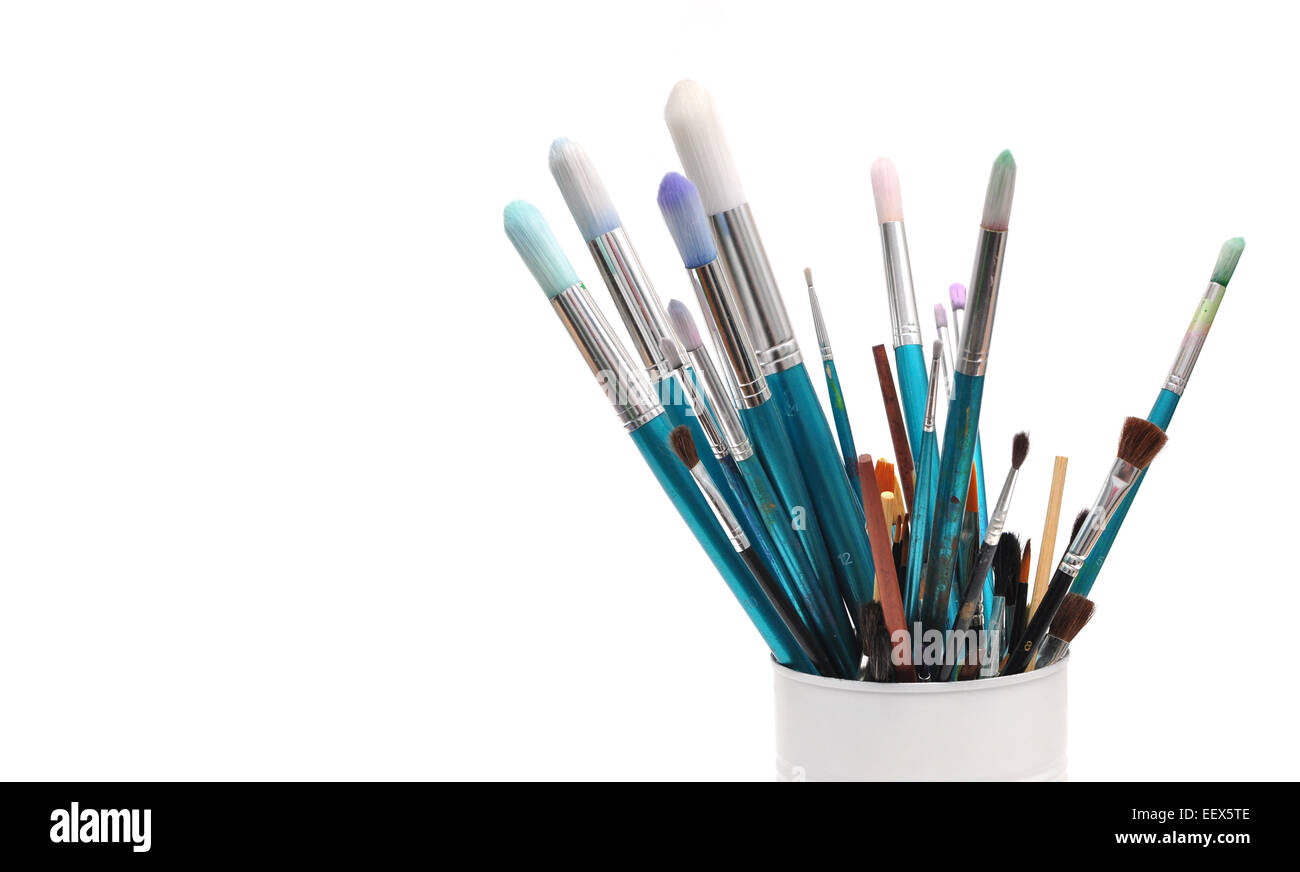 blue paint brushes in cup isolated on white background Stock Photo - Alamy