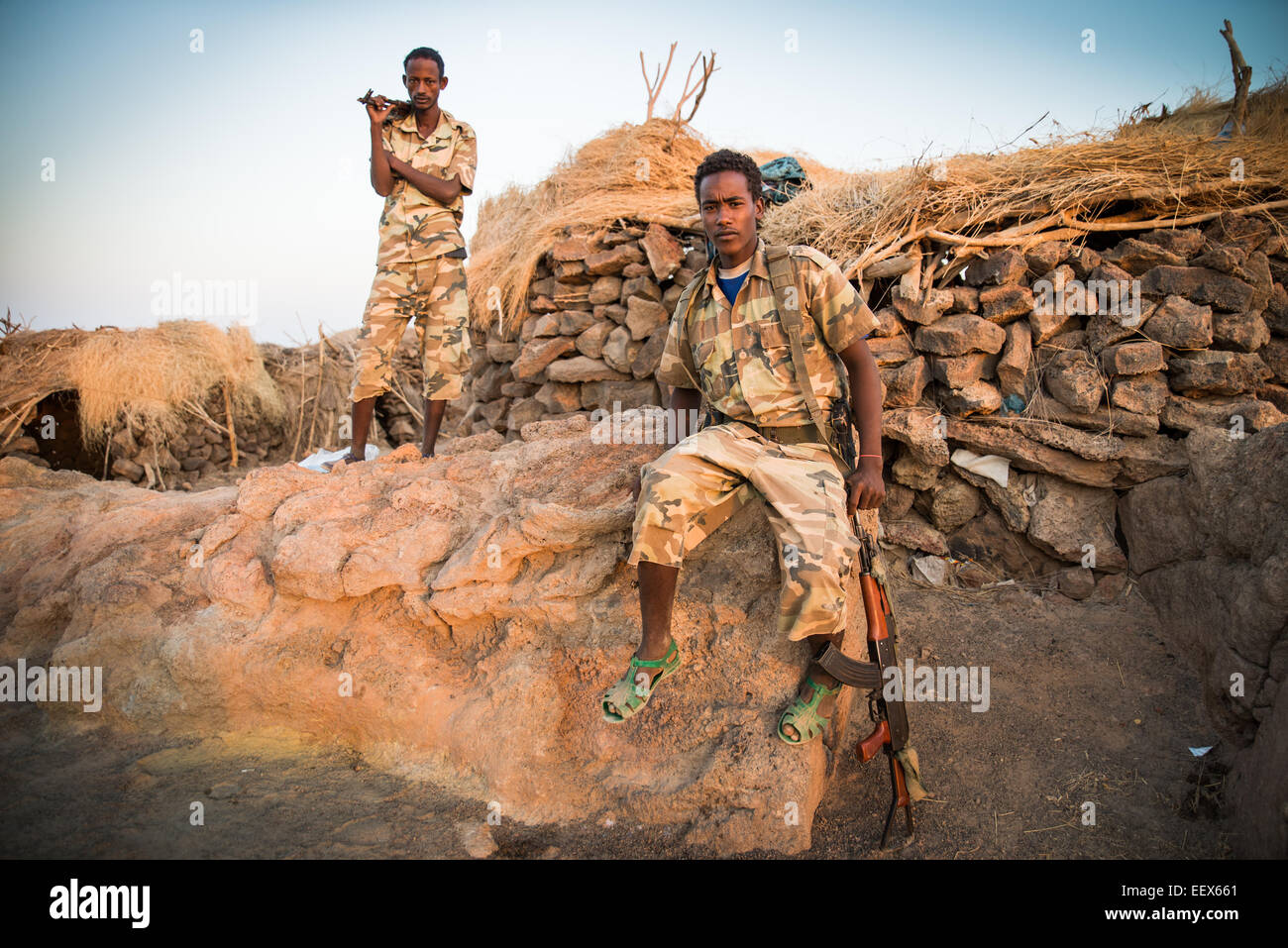 Army men in the village, Danakil depression, Ethiopia, Africa. Stock Photo