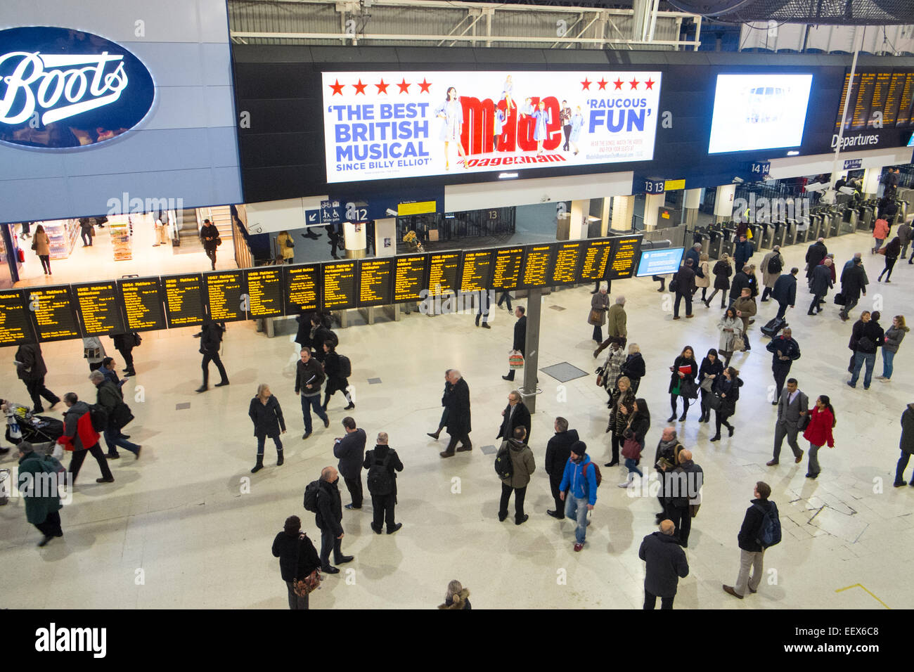 London waterloo railway station and commuters wait for trains on the concourse,London,England Stock Photo