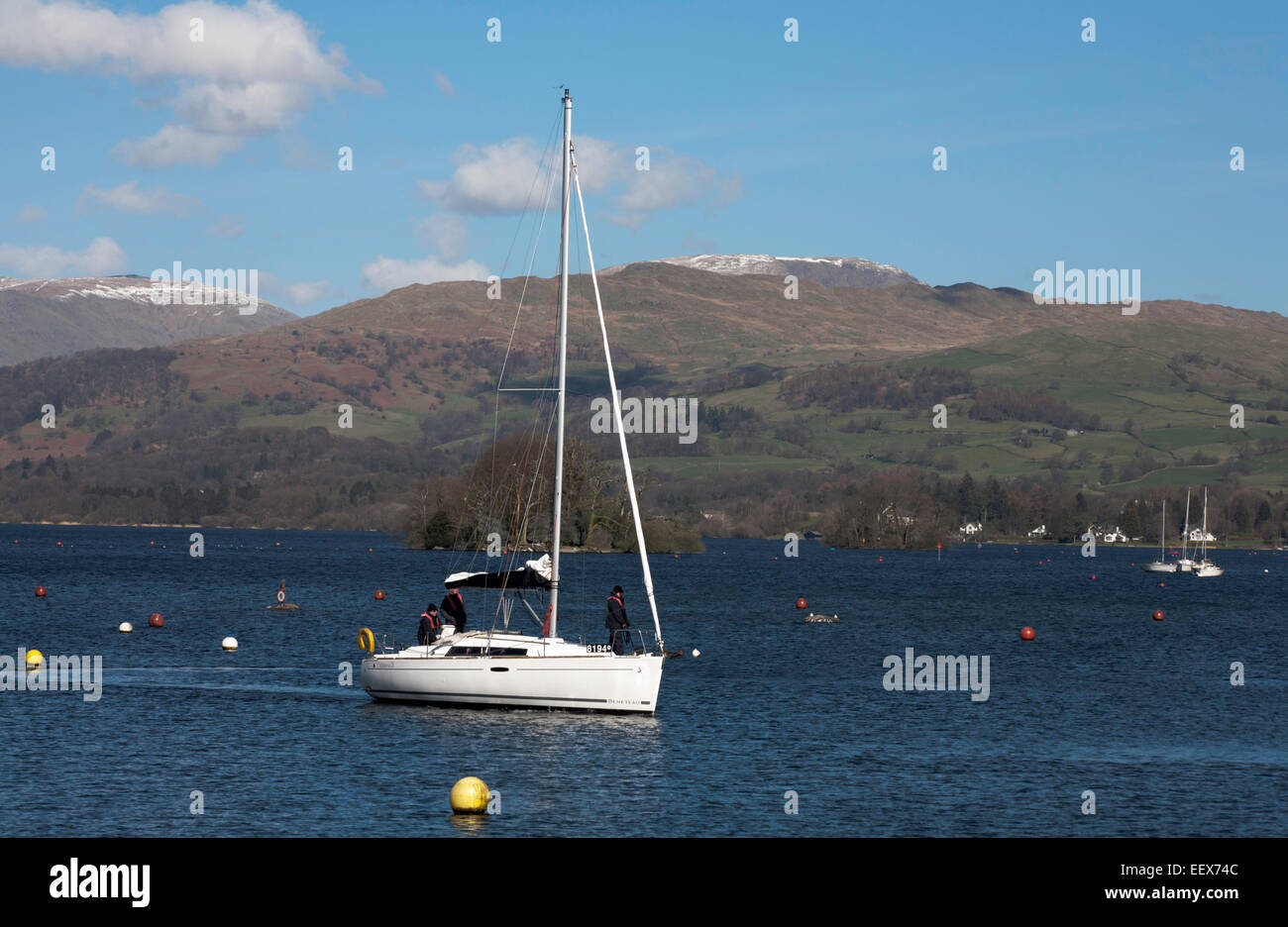 Yacht sailing on Windermere with The Fairfield Horseshoe above