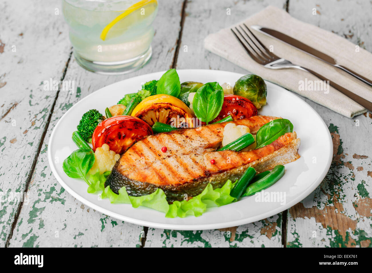 steak grilled salmon with vegetables on a plate Stock Photo - Alamy