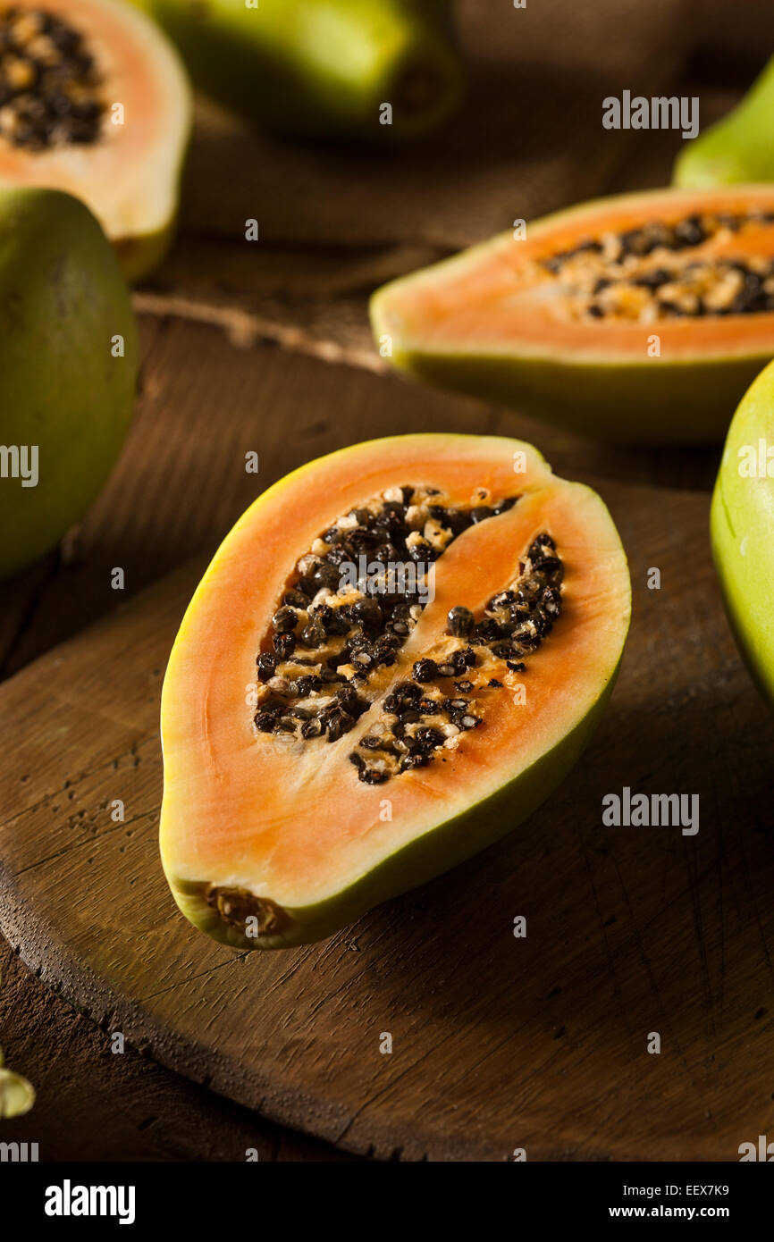 Raw Organic Green Papaya with Black Seeds Stock Photo - Alamy