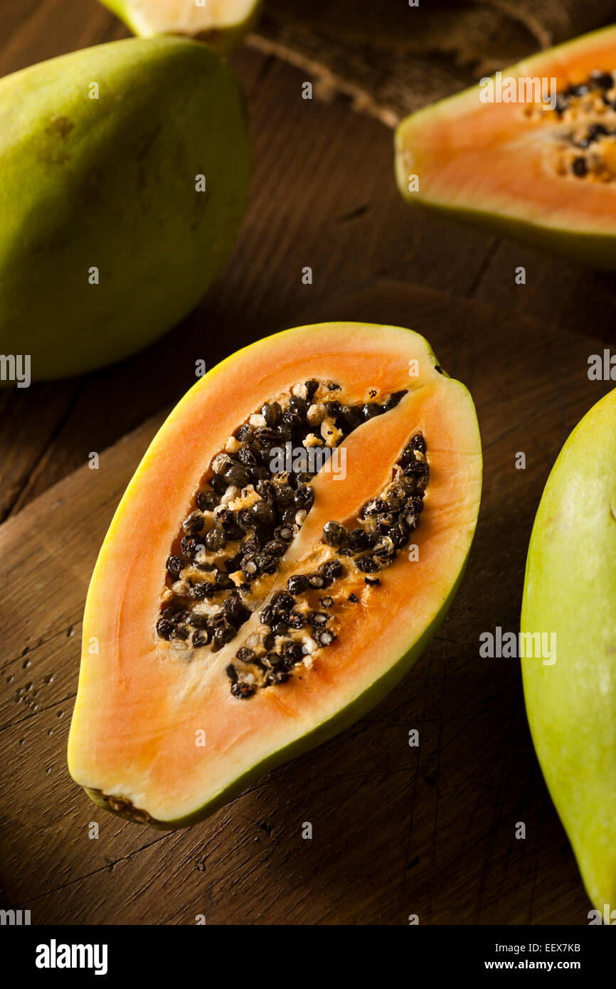 Raw Organic Green Papaya with Black Seeds Stock Photo