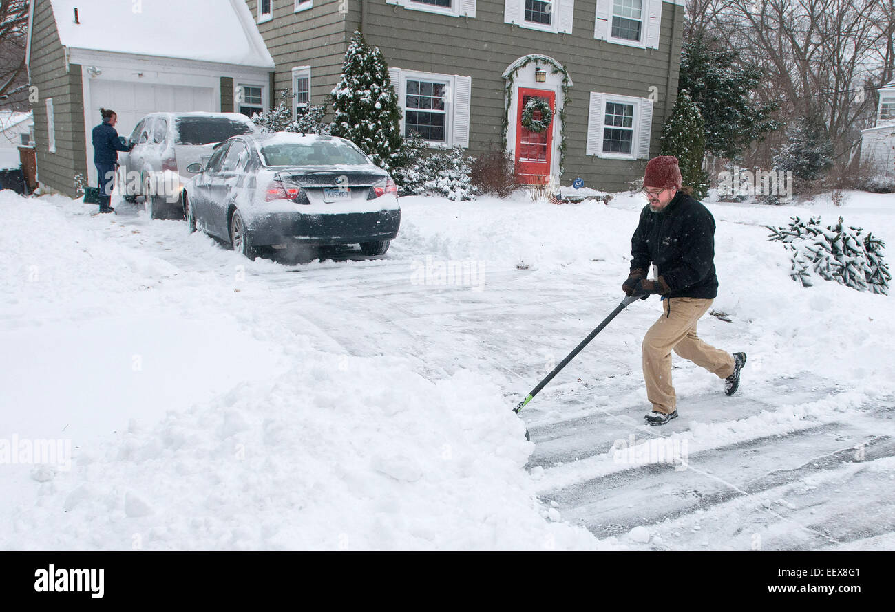 People dig out early Friday morning January 3, 2014 in the Westville section of New Haven. Stock Photo
