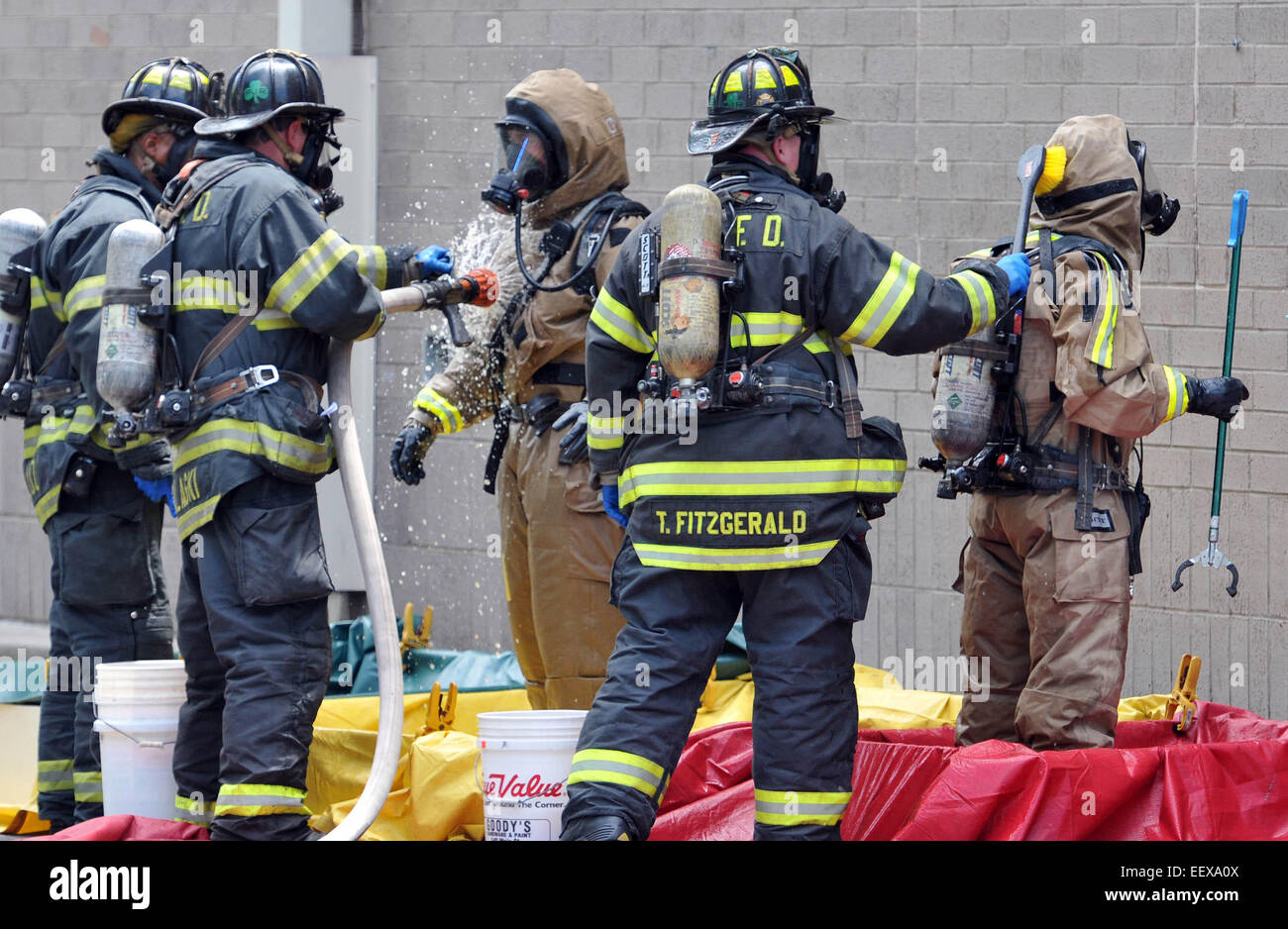 New Haven Firefighters in hazmat suits clean off after a spill at the New Haven Walgreens (York Street) that sent 4-people to the hospital . July 9, 2014. CT USA Stock Photo