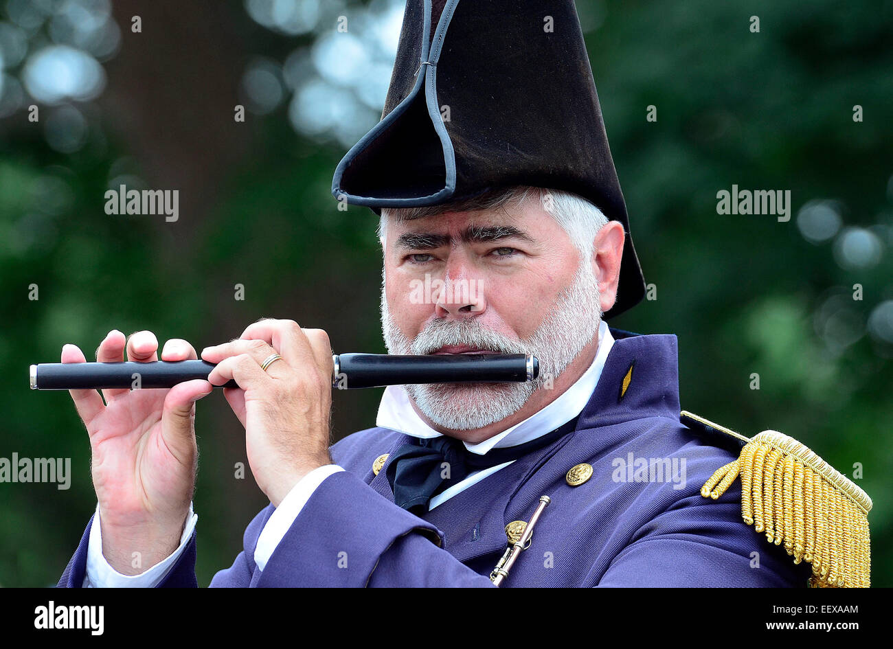 Bob Miorelli of the 'Sailing Masters of 1812' fire and drum corps plays the fife during a performance at the Clinton town 350th anniversary festival. CT USA Stock Photo