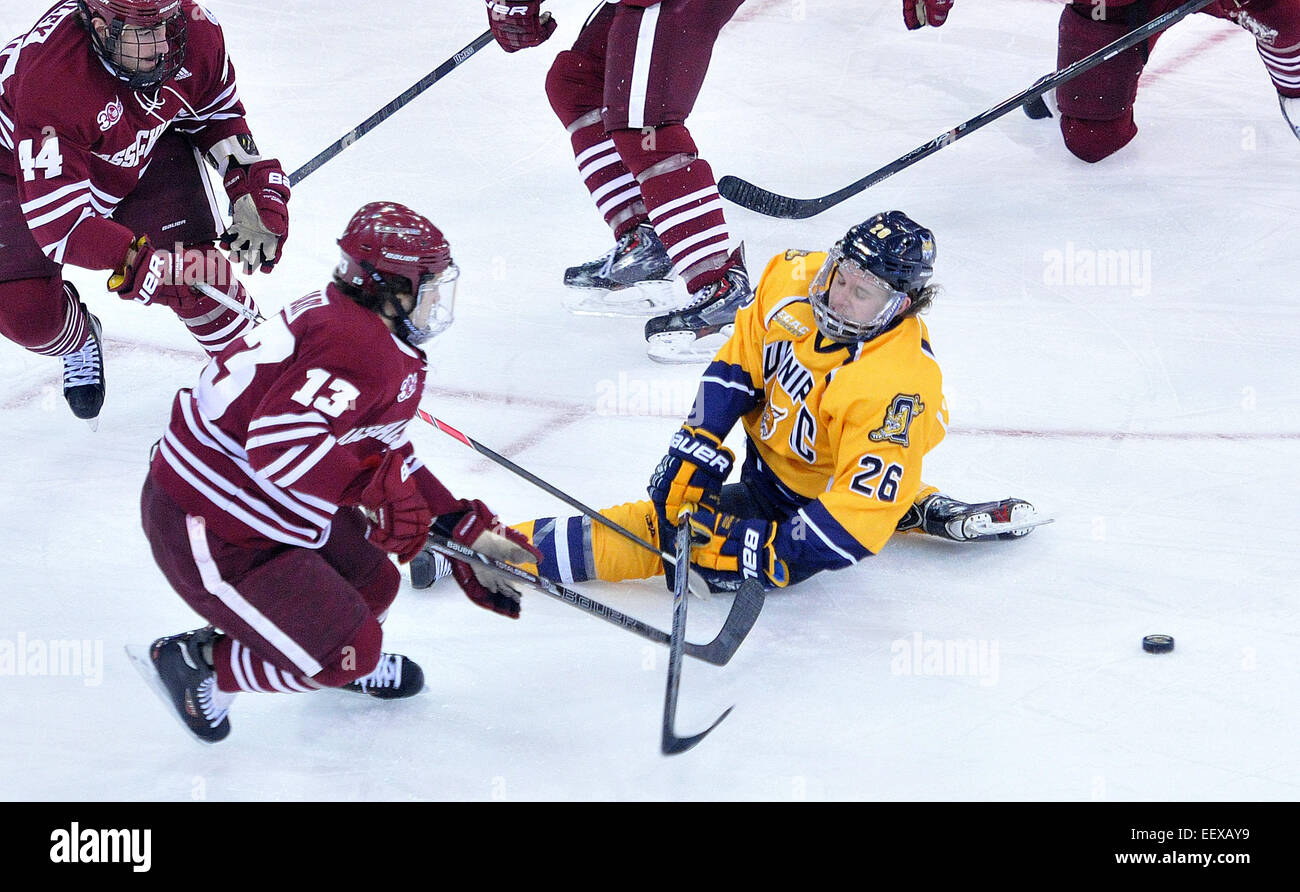 Quinnipiac's Travis St. Denis defends a shot as Umass' Conor Shearey takes the shot during the first period. Stock Photo
