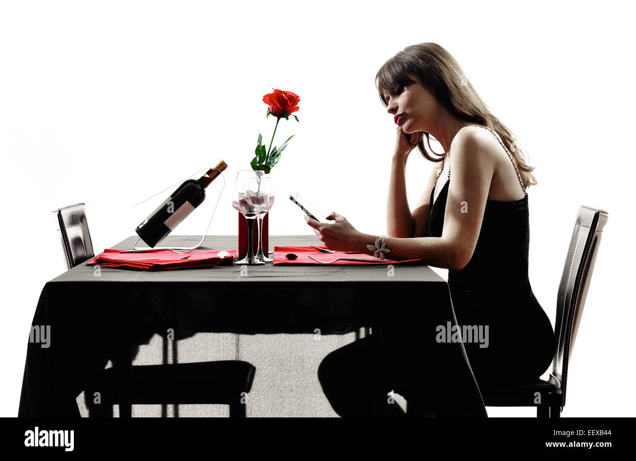 one woman waiting dinning in silhouettes on white background Stock Photo
