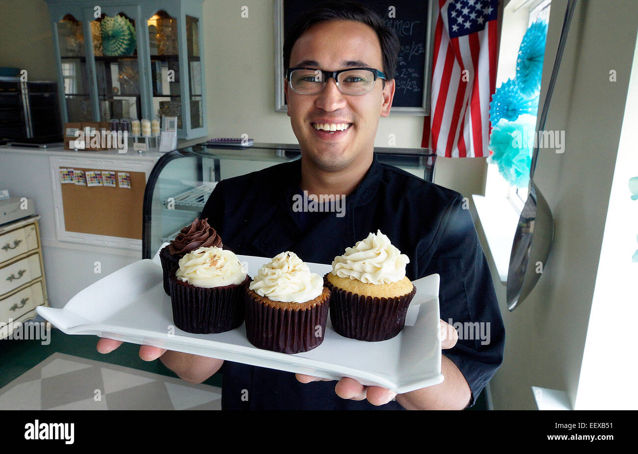 CT- USA David Negreiro owner of Taste and See cupcake shop with some of the shops favorites. Stock Photo